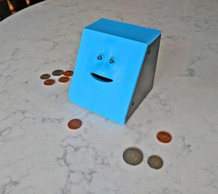 Face Bank: A Creepy Chewing Coin Bank That Eats Your Coins