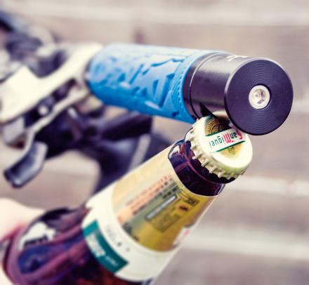 A Bottle Opener That Attaches To Your Bike's Handlebars