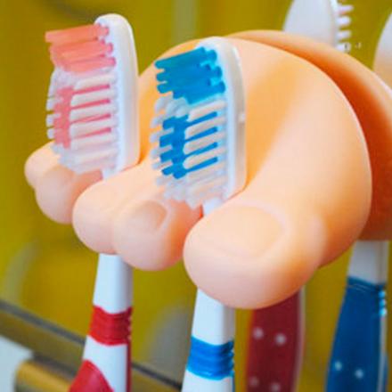 This Foot Toothbrush Holder Holds Toothbrushes or Cords Between The Toes