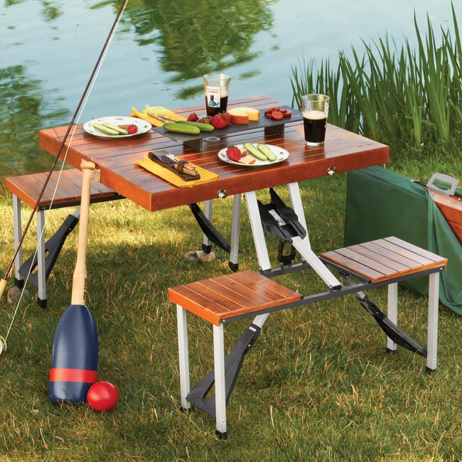 this wooden picnic table folds down to a briefcase for