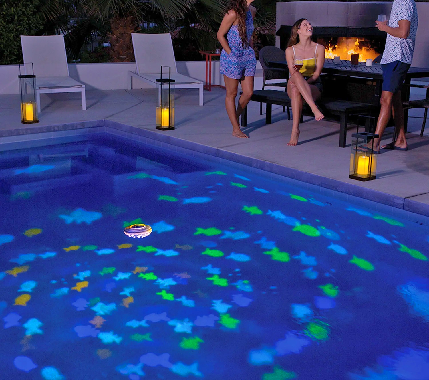 Floating Projection Light Turns Your Pool Into an Aquarium - SwimWays Rainbow Reef Aquarium Pool Light