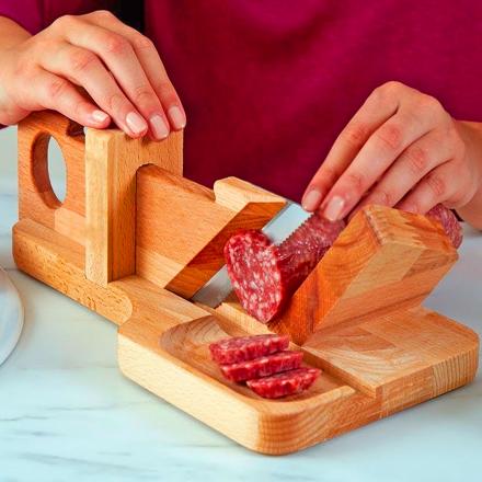 A traditional wooden salami slicer is seen close up on a market stall  during an agricultural and farming fair. Rustic butcher's tool for cutting  cured meats Stock Photo - Alamy