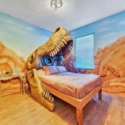 This Dino-Themed Airbnb Features Giant Dinosaurs Built Into Each Bedroom