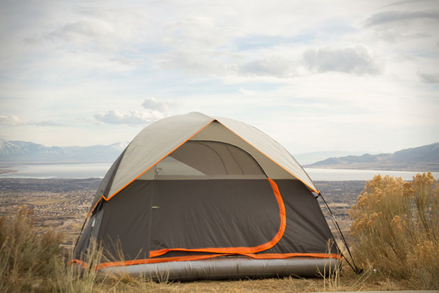 Camping tent with outlet air mattress