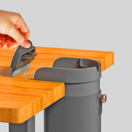 This Desk Mounted Trash Bin Lets You Quickly Sweep Crumbs and Clean Your Desk