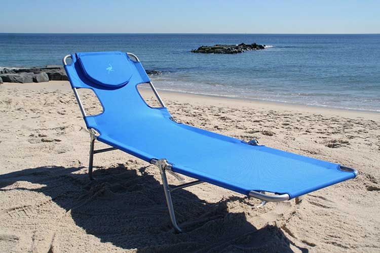 This Face Down Beach Lounge Chair Has Arm Holes and a Breast