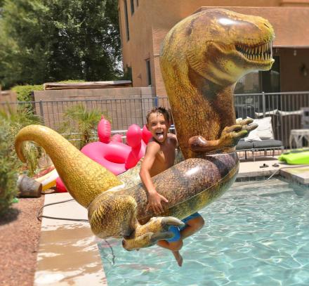 There's Now a Giant T-Rex Pool Float, And Yes He Even Has Tiny Little Arms