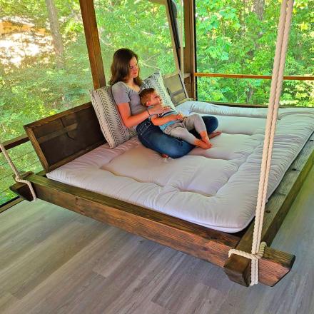 This Giant Hanging Porch Bed Is The Perfect Summer Lounging Spot