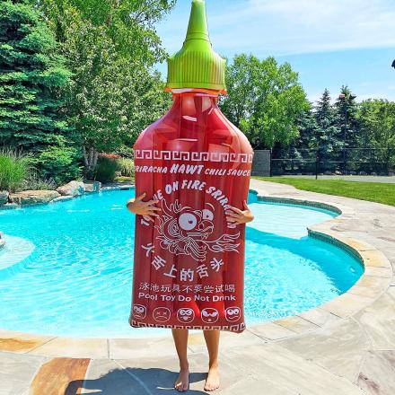 Every Hot Sauce Lover Needs This Giant Sriracha Bottle Pool Float