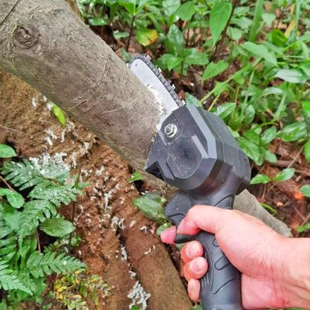 This Handheld Mini Chainsaw Is The Perfect Tool For Trimming and Pruning