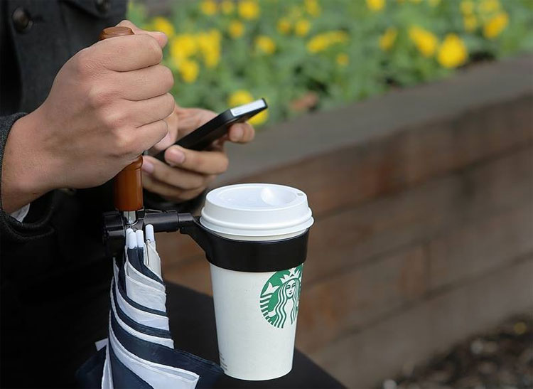 Umbrella Holds Your Cups For You, This umbrella has an unspillable cup  holder. ☂️, By Inventions Insider