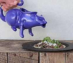 This Puking Cat Gravy Boat Might Be The Grossest Way To Serve Gravy At Dinner