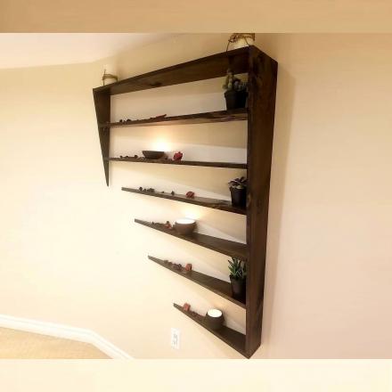 This Unique Shelf Design Looks Like It's Disappearing Into The Wall