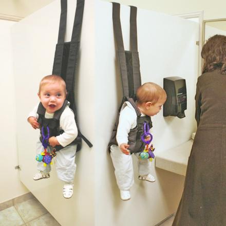 This Baby Carrier Lets You Hang Your Baby On The Bathroom Stall When Using The Toilet