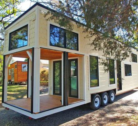 This Farmhouse Style Tiny Home Has Its Own Built-In Porch Area