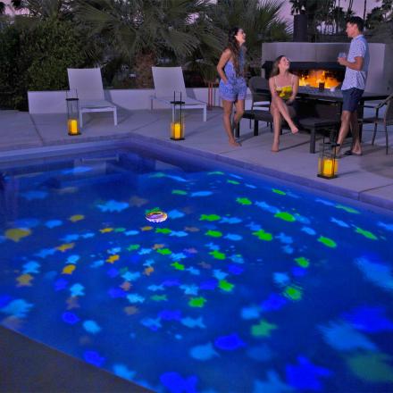 This Floating Pool Projector Light Turns Your Pool Into an Aquarium At Night