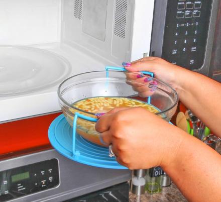 This Genius Bowl Holder Lets You Safely Remove Scalding Hot Bowls From The Microwave