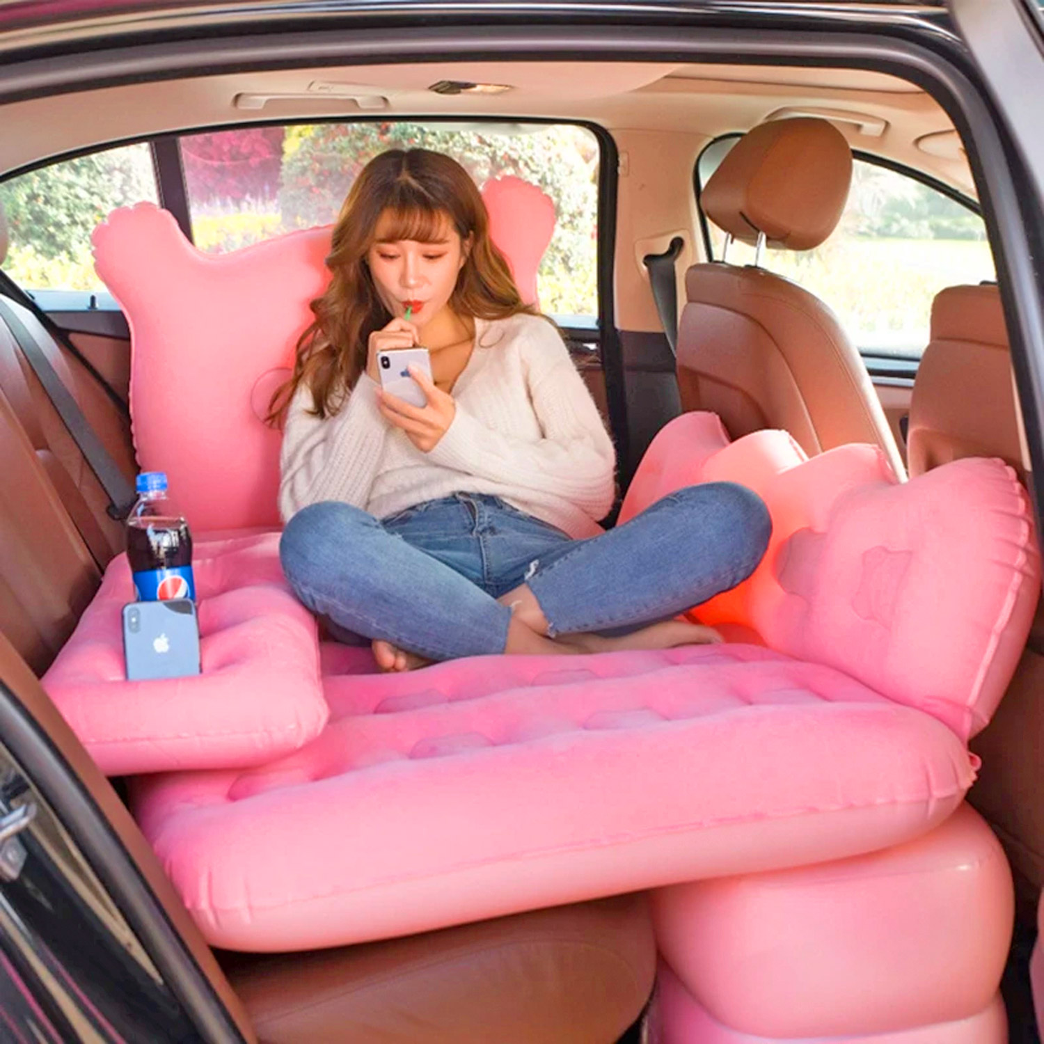 this inflatable backseat lounger and bed for the car is perfect for long road trips og