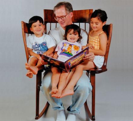 Every Grandparent Probably Needs This Rocking Chair That Helps You Hold 3 Kids!