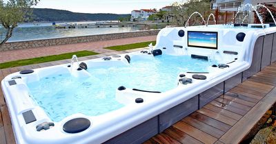 This Ultimate Hot Tub Has Two Tiers With an Attached Endless Swimming Pool