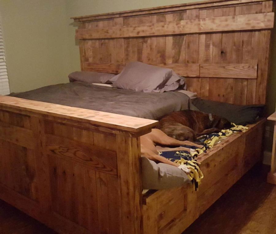 this wooden king bed frame leaves extra space for your dogs 0