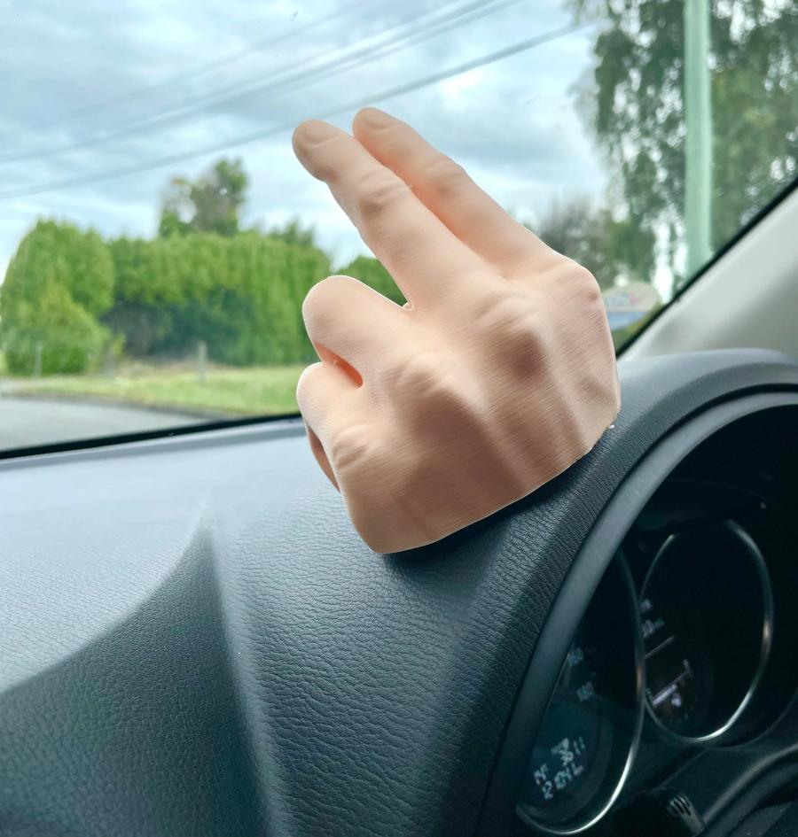 This 2-Finger Waving Hand Mounts To Your Dashboard, Never Miss Another Wave  Again