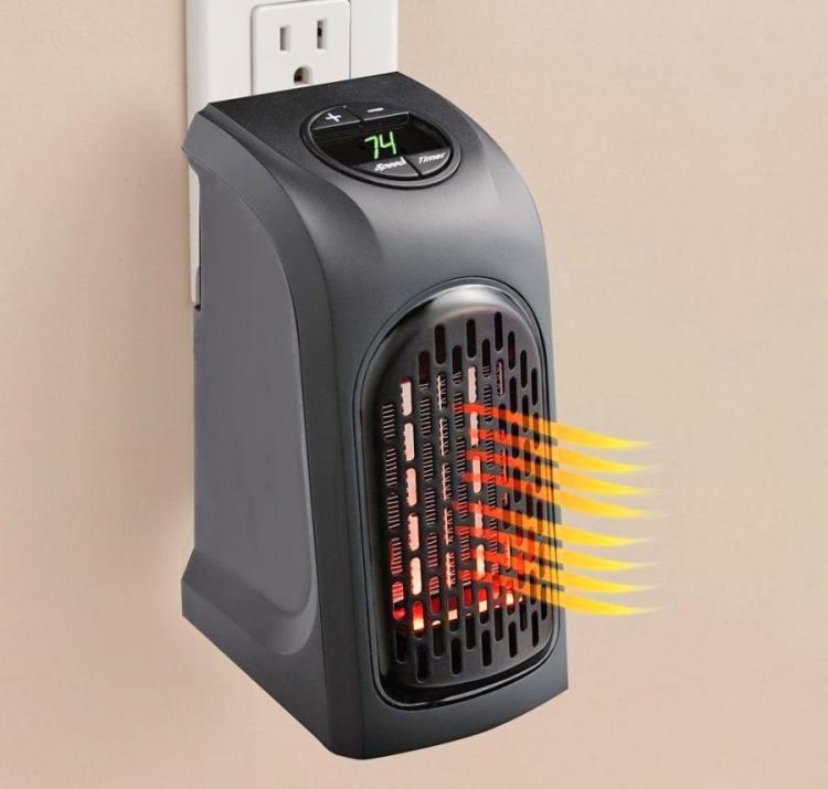 A Mini Portable Heater That Attaches To Any Outlet