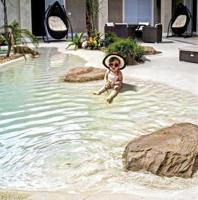 Beach entry walk in pools made from real sand