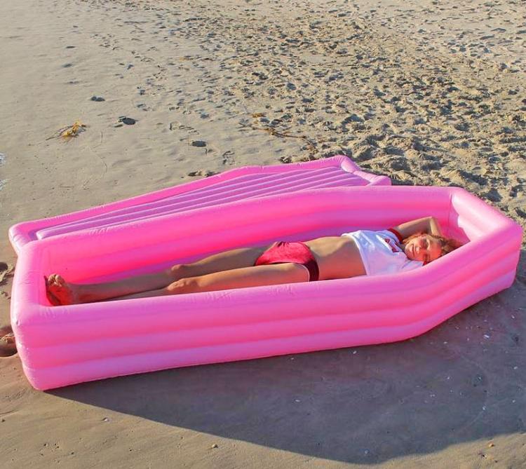 coffin pool float with lid. 