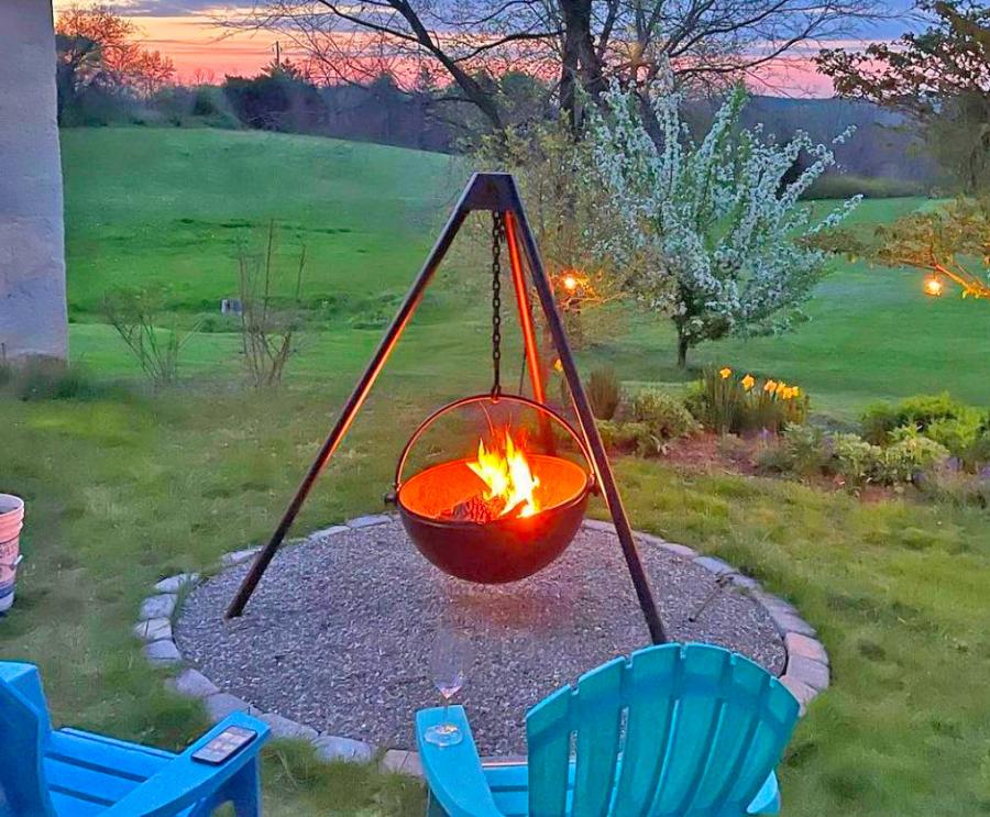 This Hanging Tripod Fire Pit Might Be The Manliest Way To BBQ Or Have a Bonfire