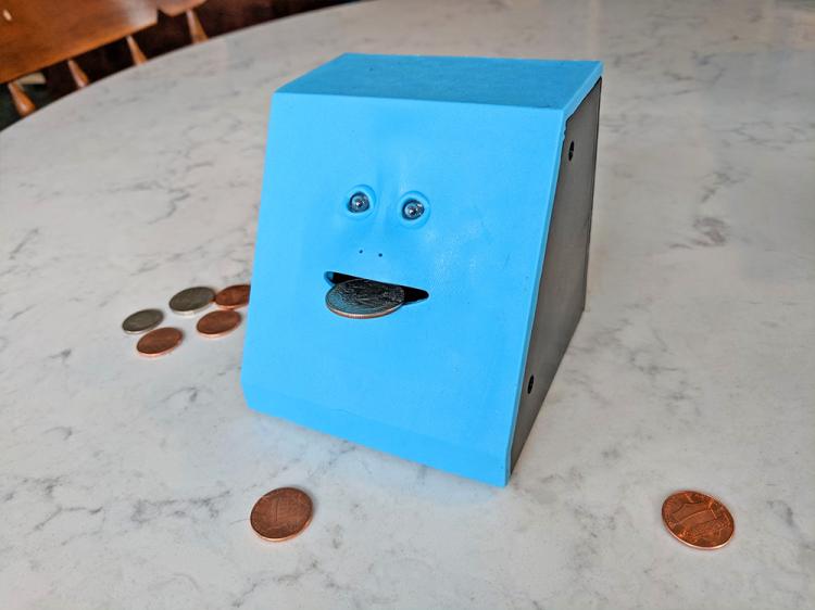 Face Bank: A Creepy Chewing Coin Bank That Eats Your Coins