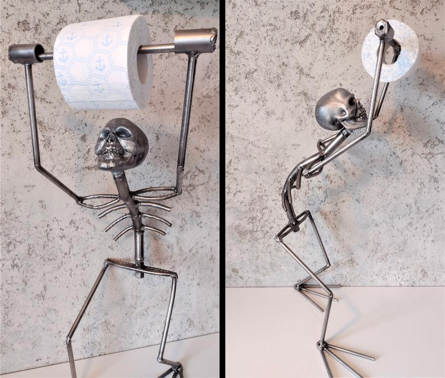 This Creepy Metal Skeleton Toilet Paper Holder Is Perfect For Horror Lovers