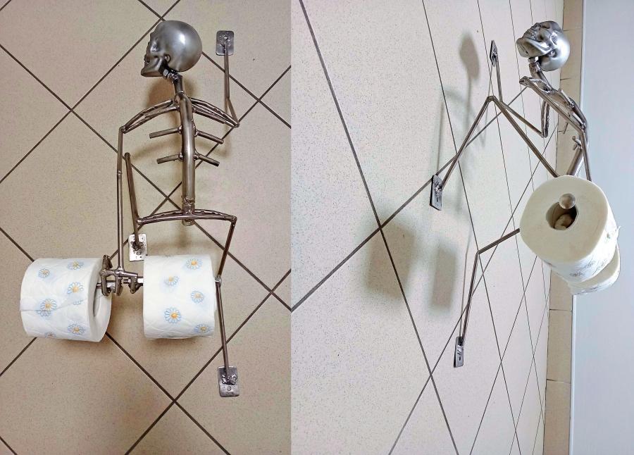 This Creepy Metal Skeleton Toilet Paper Holder Is Perfect For