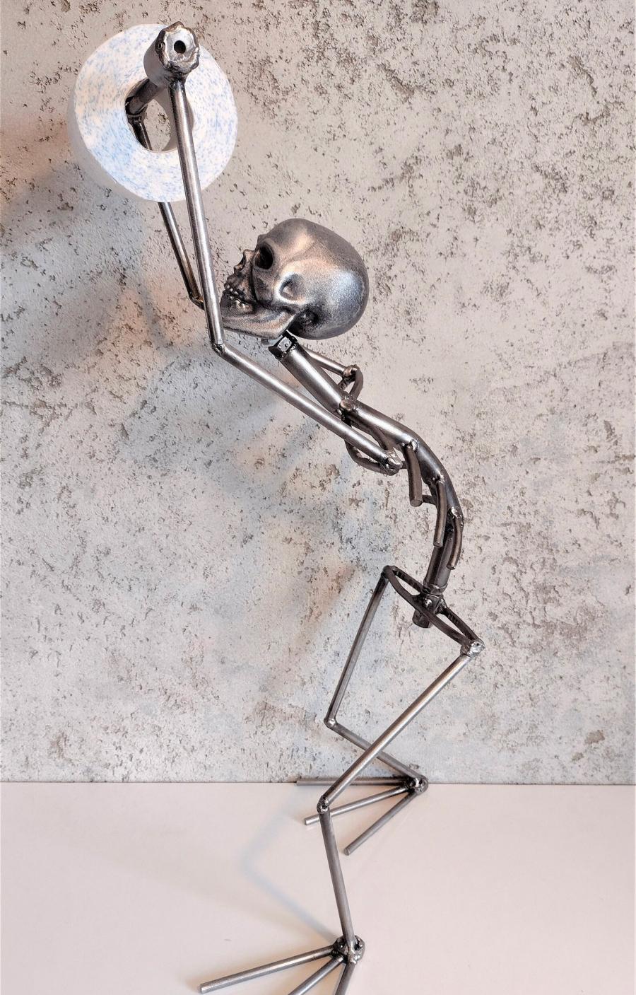 This Creepy Metal Skeleton Toilet Paper Holder Is Perfect For