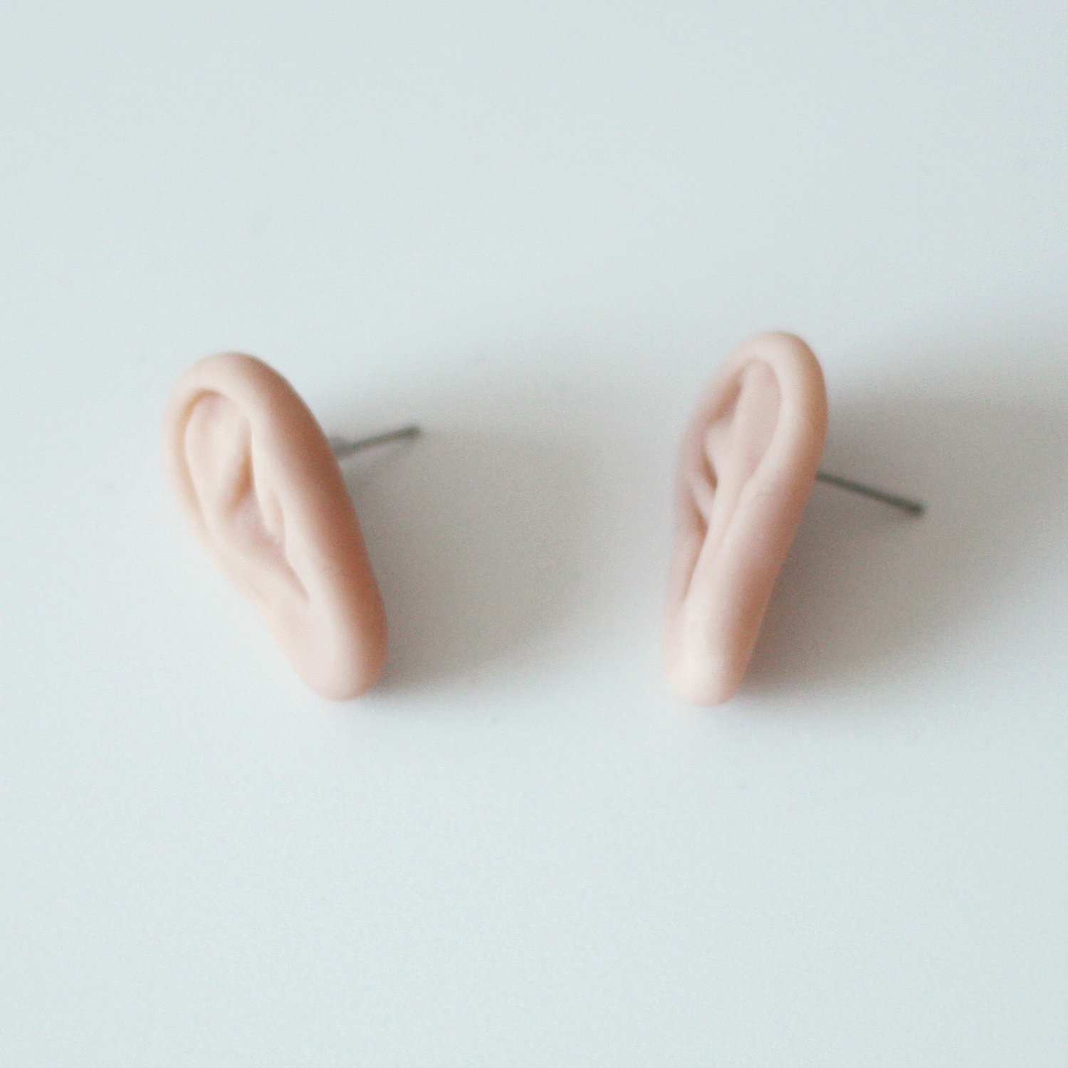 Ear shaped earrings