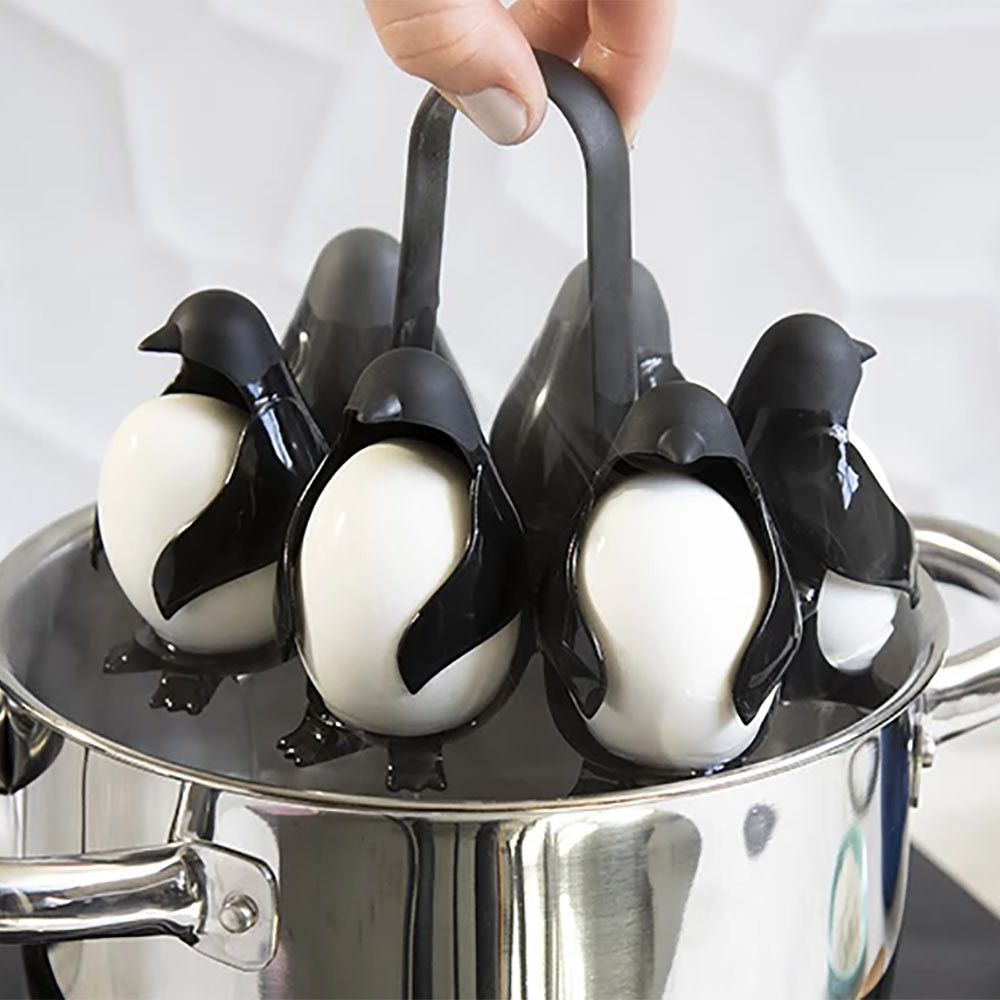 Egguins Penguin egg holders hold eggs under boiling water - penguin shaped egg server