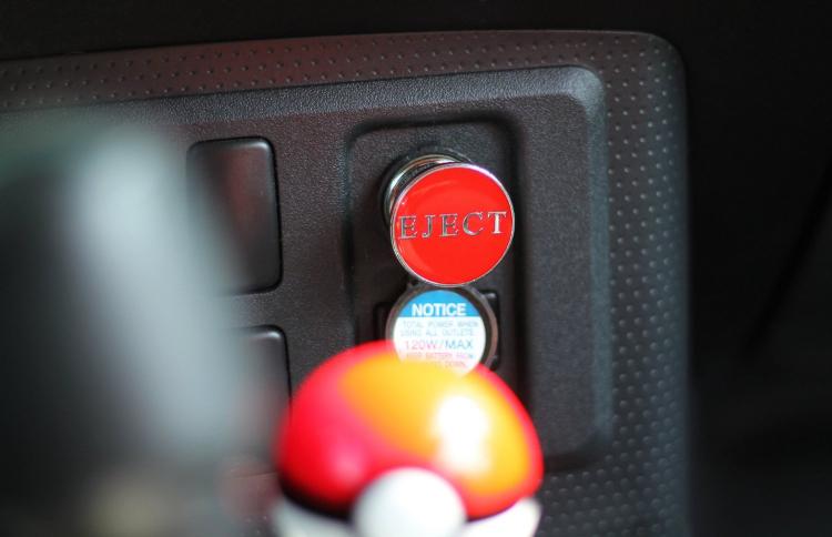 Fake eject button for car cigarette lighter