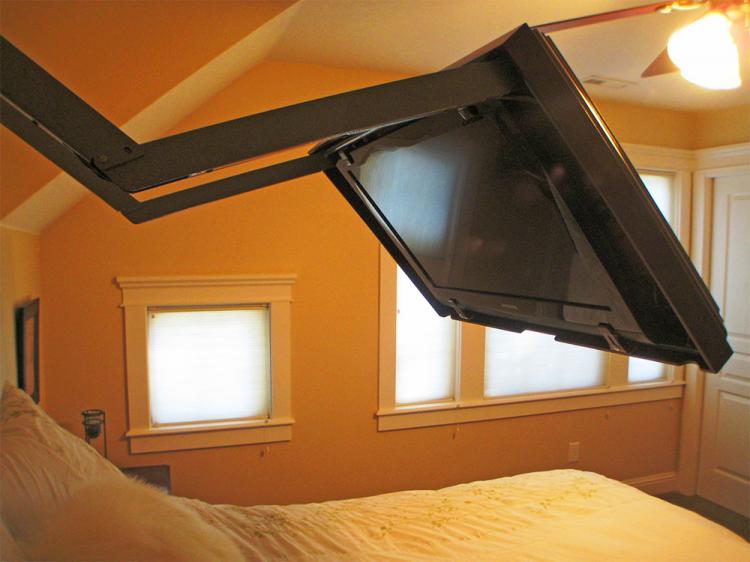 This Flip Out Tv Mount Lets You Hide Your Tv Behind A Mirror Or