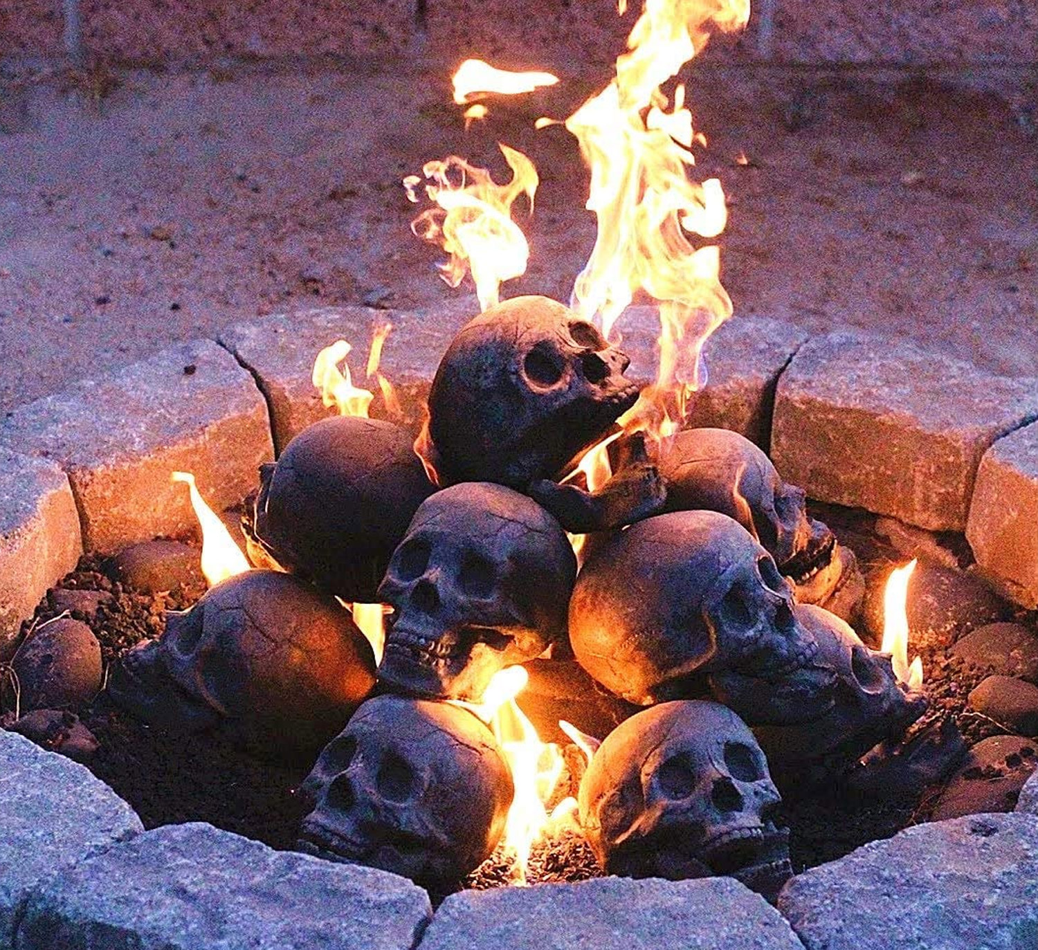 Faux human skulls fire pit