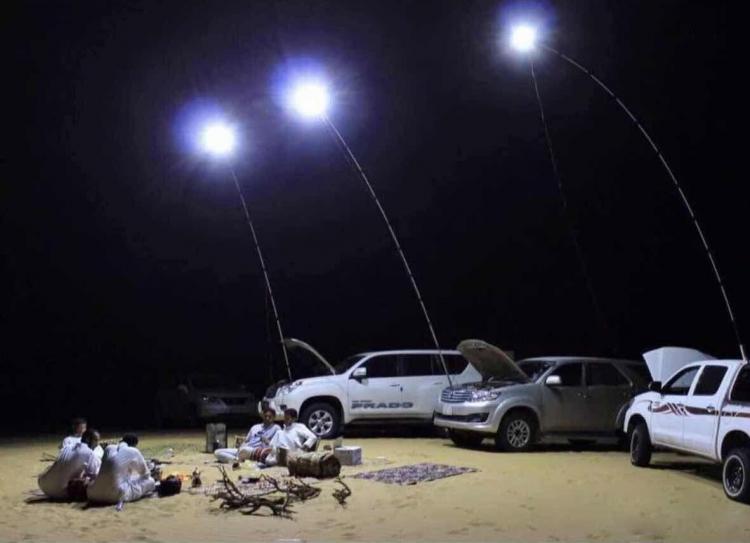 This Giant Telescoping Outdoor Lamp Attaches To Car Battery