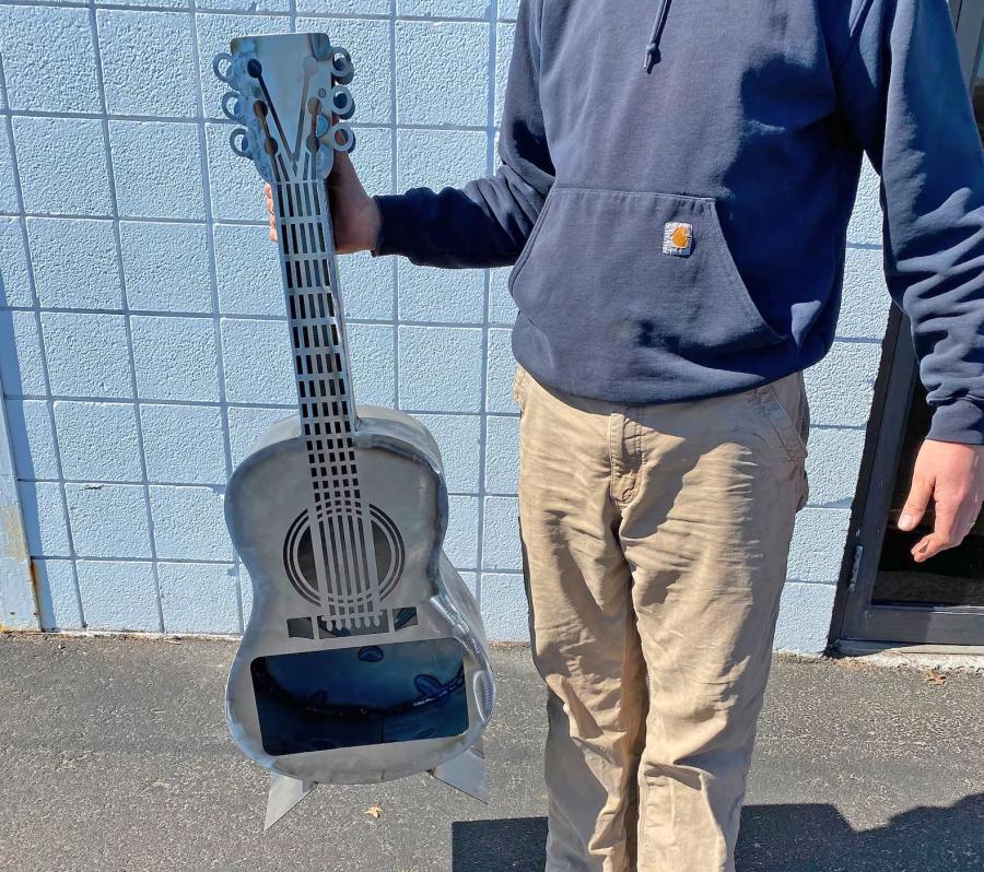 Guitar Fire Pit - Metal guitar shaped wood burning stove