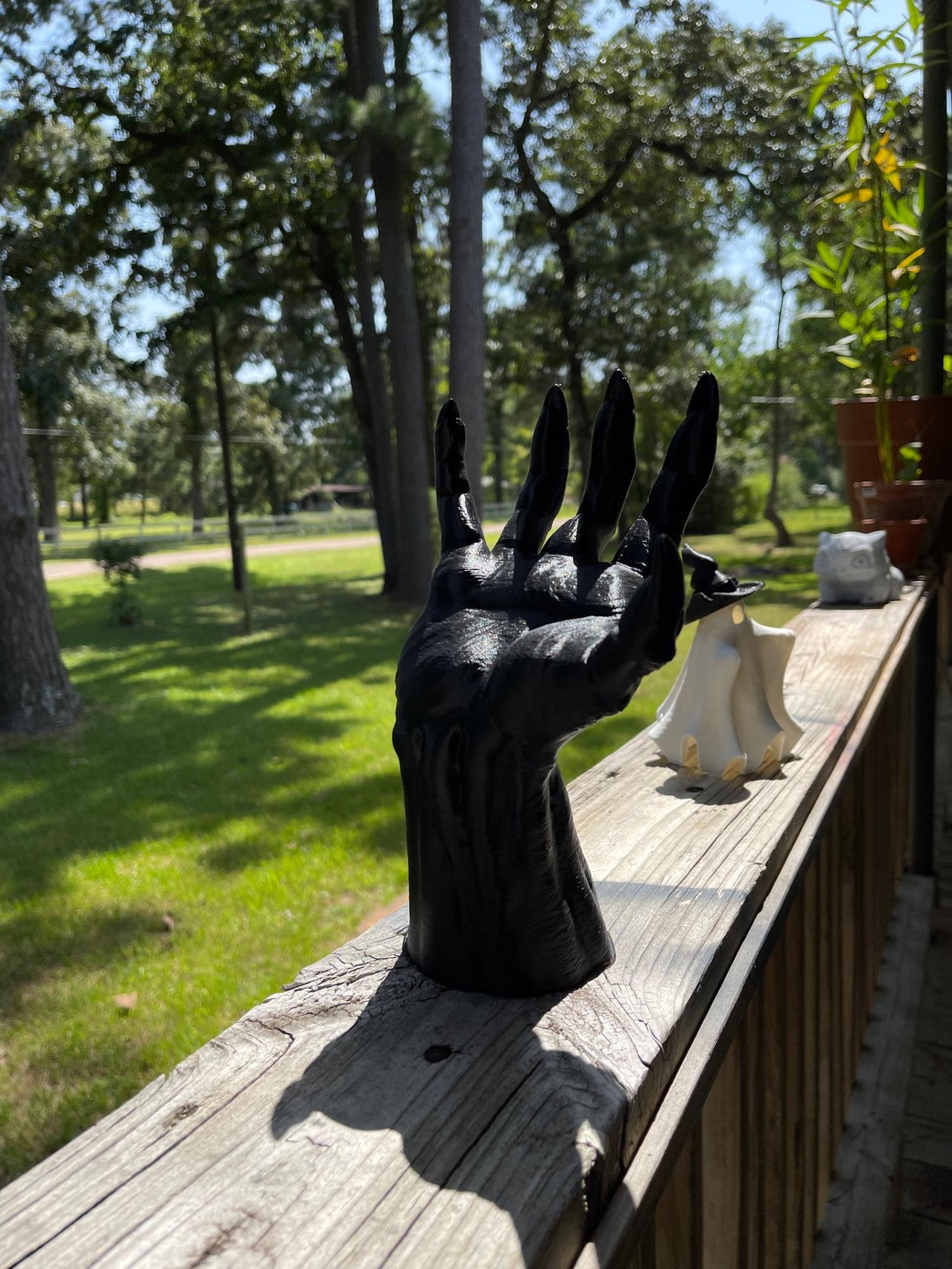 Life-sized demon hand halloween decoration