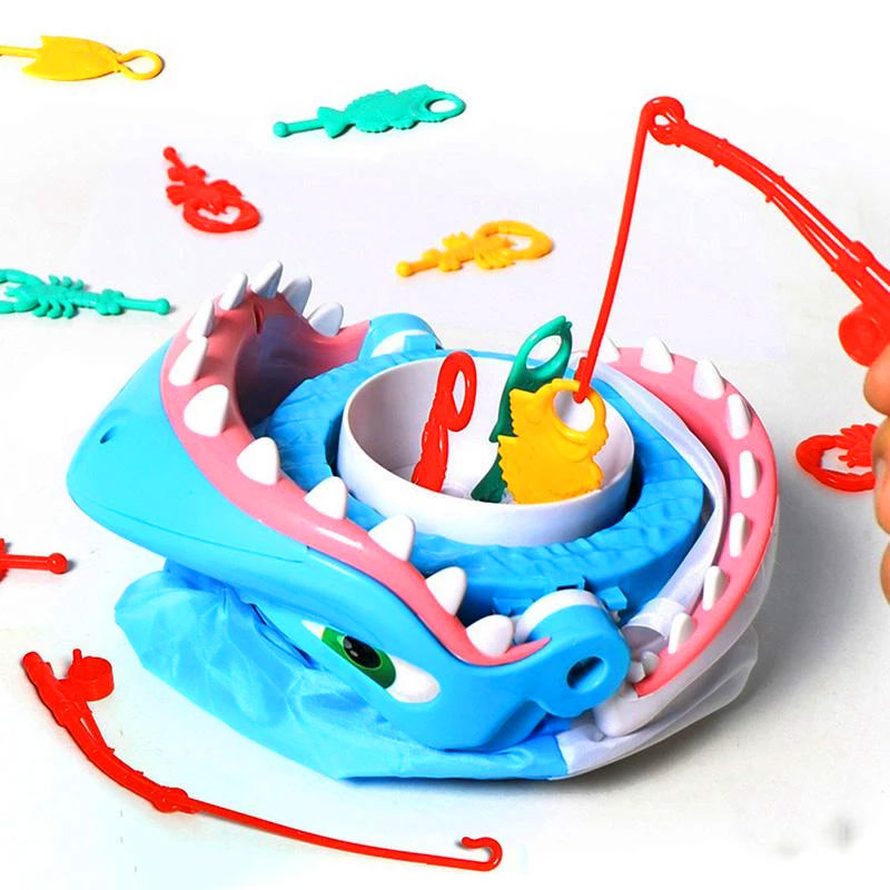 Have Fun While Teaching Fine Motor Skills With This Shark Bite Game