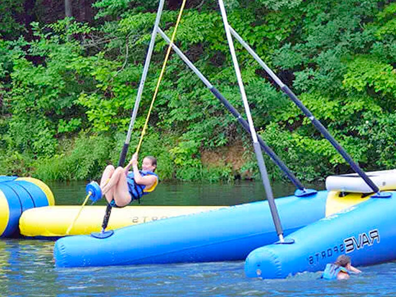 This Inflatable Floating Rope Swing Is a Must For Lake Property Owners