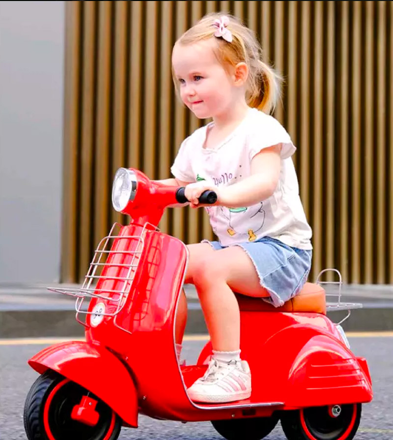 Childs electric vespa outlet scooter