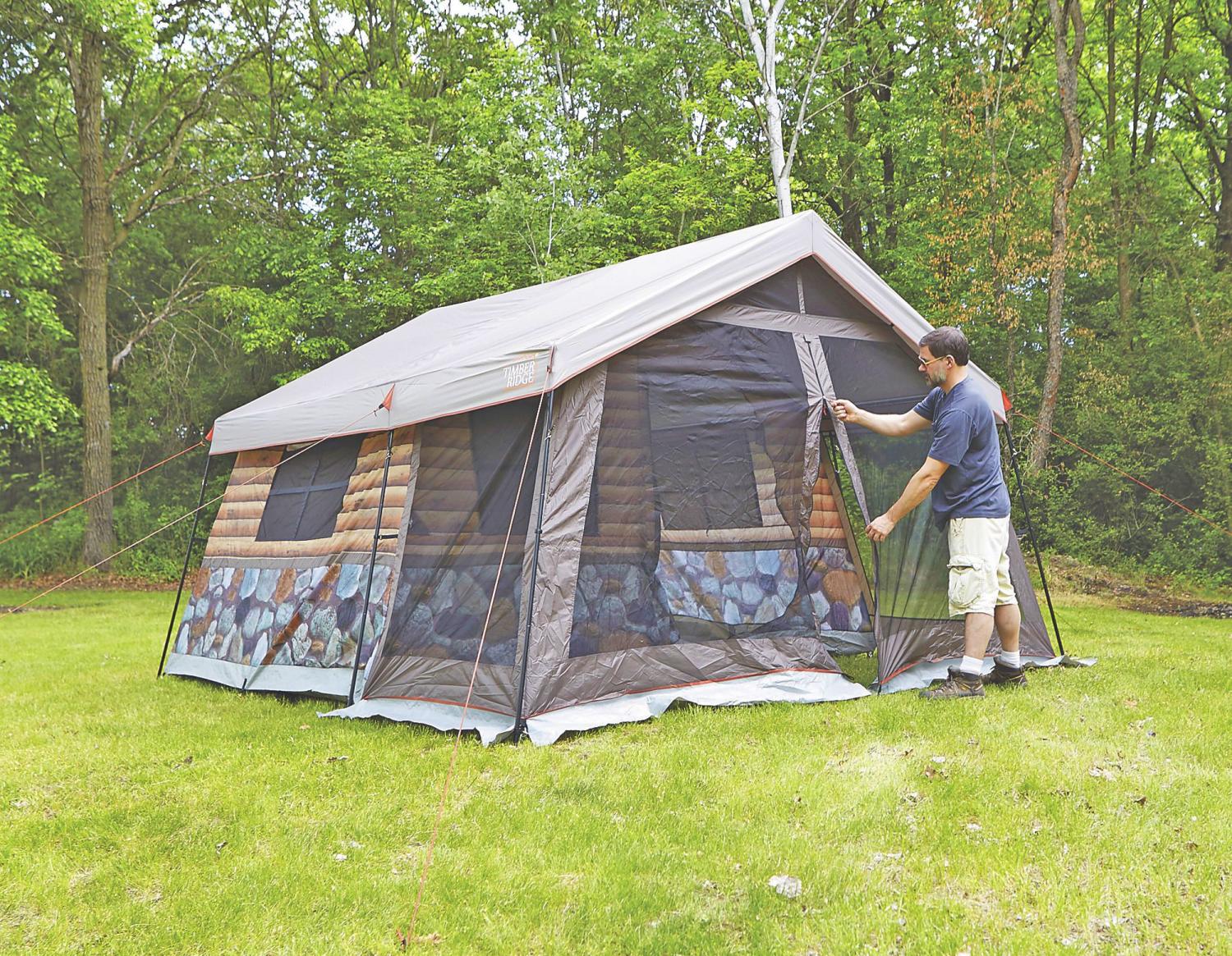 This Log Cabin Tent Has a Giant Screened In Front Porch For a True
