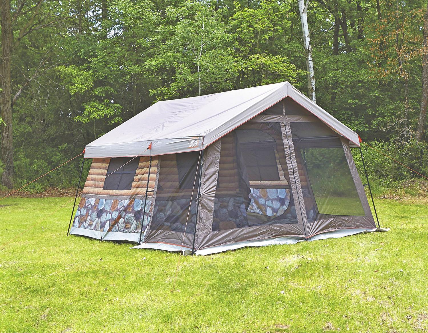 This Log Cabin Tent Has a Giant Screened In Front Porch For a True Luxury Camping Experience