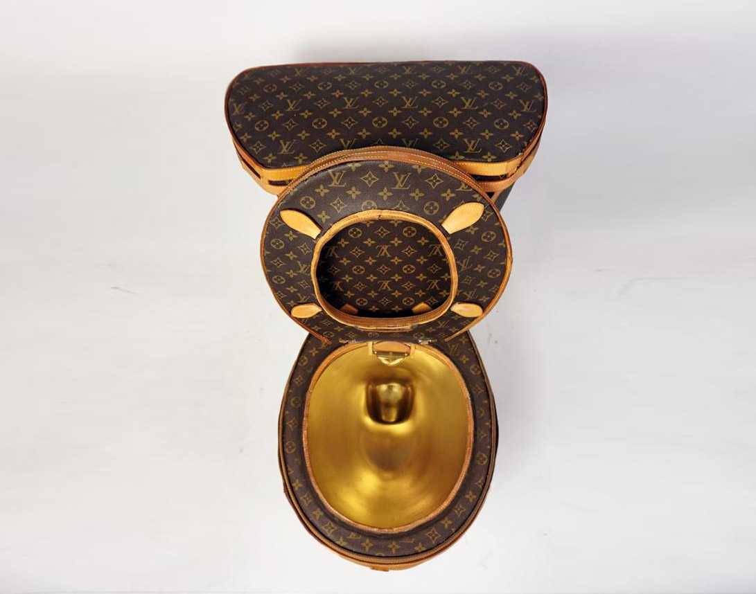 Golden toilet covered in Louis Vuitton bags put on sale for