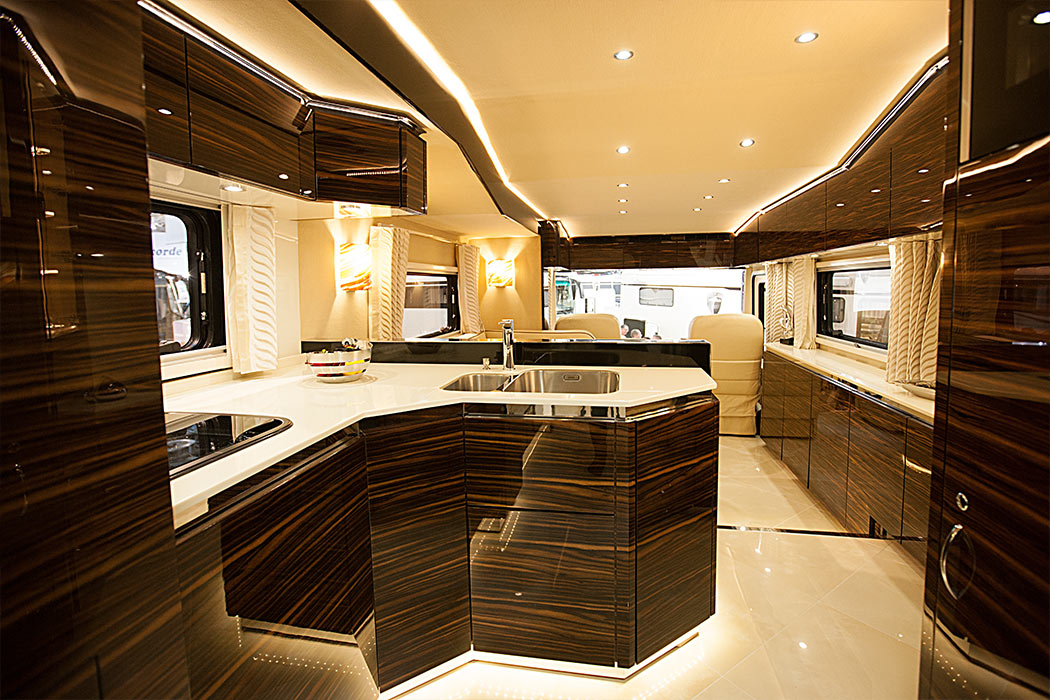 This $1.7 Million Luxury Motorhome has Its Own Side-Load Garage To Hold