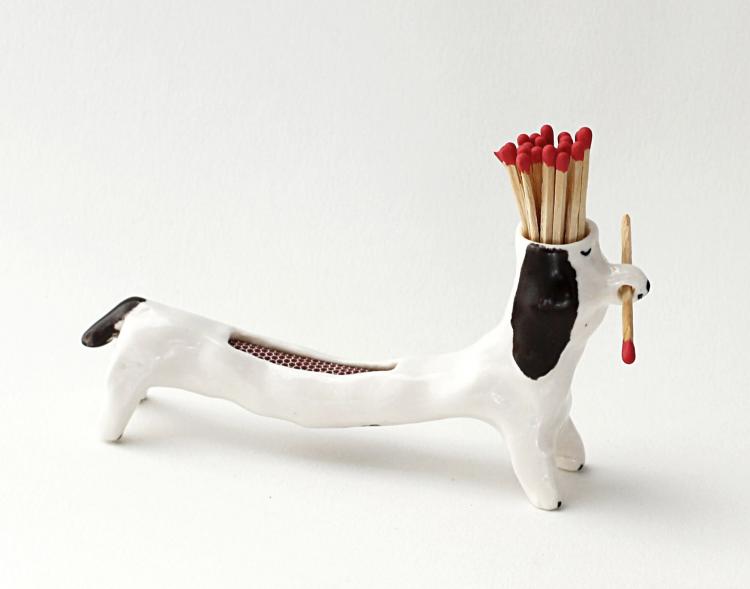 Matchstick Holding Dog - With Striker Area on Its Back